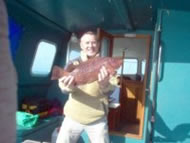 Skipper Dave Bobbett with a Wrasse